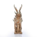 Pottery model of an earth spirit Chinese, Tang dynasty unglazed painted with a red pigment, with