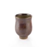 Tim Andrews (b.1960) Tea bowl iron glaze with roundel decoration impressed potter's seal 11cm high.