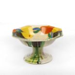 Clarice Cliff Bizarre Delecia tazza painted with fruit and flowers 9cm high.One repaired chip to