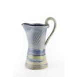 Jane Hamlyn (b.1940) Jug blue and green glaze impressed potter's seal 26cm high.