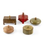 Ebena Five lidded boxes, 1920s crushed copal (amber), the figural tops made from galalith tallest