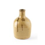 William Marshall (1923-2007) Bottle vase ochre glaze with dripped detail 16cm high.Surface pits,