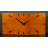 An art deco wooden wall clock with Garrard movement, 58.5cm wide x 29cm highScratches to the