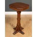 A 19th century Gothic style pine occasional table with an octagonal top and a single drawer, 41cm