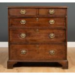 A George III mahogany chest of two short and three long drawers raised on bracket feet, 87cm wide