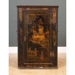 A 19th century corner cabinet with lacquered chinoiserie decoration, 56cm wide x 26cm deep x 84.
