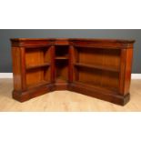 An early Victorian mahogany open front corner bookcase with adjustable shelves and a plinth base,