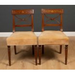 A pair of George III walnut bar backed chairs with satinwood inlaid decoration, upholstered seats