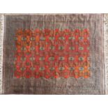 A mid to late 20th century Bokhara red ground rug with a detailed multiple banded border and