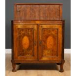 An early 19th century mahogany and satinwood inlaid marquetry side cabinet the raised top with a