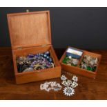 A box of paste and costume jewellery, necklaces, buckles, brooches etc.Seemingly resonable condition