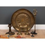 An arts and crafts brass tray, 51.5cm diameter, together with a pair of Indian style engraved