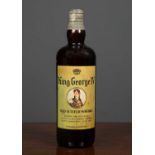 A bottle of King George IV Old Scotch WhiskyLevel at mid neck, some oxidisation to the seal but