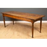 A 19th century oak dining table on turned supports with pokerwork decoration to the top, 205cm long,