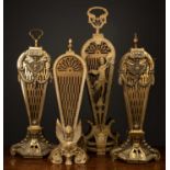 A group of four brass fan shaped fire screens the brass fan shaped pieces with cut out decoration