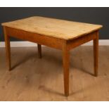 A late 19th/early 20th century pine kitchen table with square tapering legs, 135cm wide, 75cm