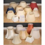 A collection of eighteen various lampshades to include circular, square and shaped base shades in