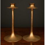 A pair of arts and crafts Dryad brass candlesticks, with monogrammed initials to the base, 24.5cm