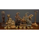 A collection of brass door stops to include horses, the Cheshire Cat, ships, pixies and further