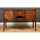 A George III mahogany bow fronted sideboard with two deep drawers flanking a central drawer above