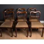A set of six 19th century rosewood dining chairs with shaped backs, horizontal cast splats, instet