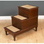 A set of mahogany library steps with integral slide out commode, the steps with lift top and slide