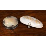 An early 20th century continental white metal and mother of pearl magnifying glass, 6cm diameter,