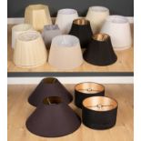 A collection of seventeen various lampshades to include circular, square and shaped base shades in a