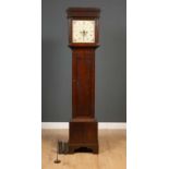 An antique 30 hour longcase clock the painted dial 30cm squared, the oak case 42cm wide x 24cm