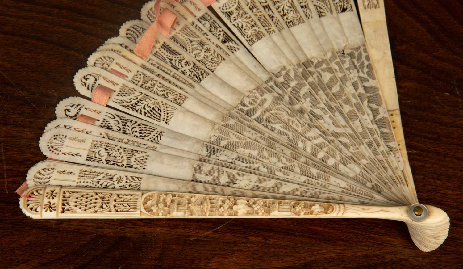 A 19th Century Chinese Carved Ivory fan 17cm in length2 strips with some damage, silk joining thread