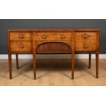 A George III mahogany sideboard with four drawers and square tapering legs terminating in spade