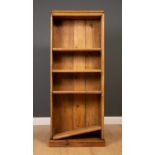 An antique pine bookocase with four adjustable shelves, 62cm wide, 154cm highSurface scratches and