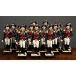 A group of fifteen cast iron painted Napoleonic soldier door stops, two larger measuring 41cm high