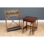 An early 20th century mahogany nest of three tables, the largest 49 cm wide x 38cm deep x 86cm high,