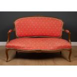 A French beechwood framed upholstered open arm settee with cabriole legs, 141cm wide x 54cm deep x