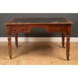 A mahogany desk with canvas inset top, two drawers, on turned tapering legs, 126cm wide, 86cm