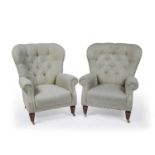Pair of contemporary armchairs with button back blue and cream brocade upholstery, on wooden legs,