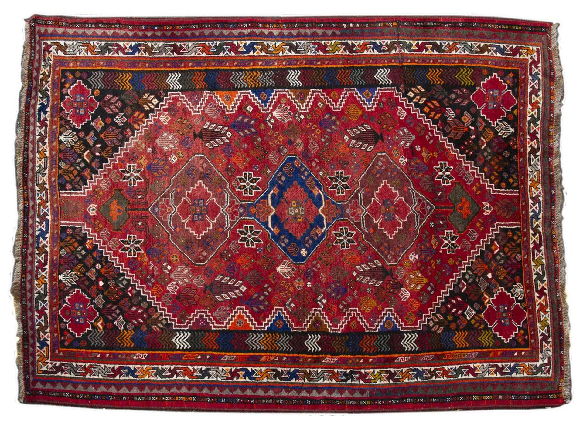 Afghanistan red ground rug with stylised foliate designs and multiple border, 173cm x 254cmLight