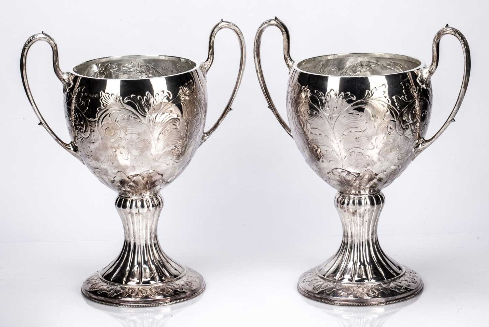 Pair of silver trophy cups with leaf capped trophy handles, on circular bases, bearing marks for R. - Image 2 of 4