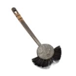 Arts and Crafts fireplace brush, with wooden handle and grotesque mask decoration, 61cm overallAt