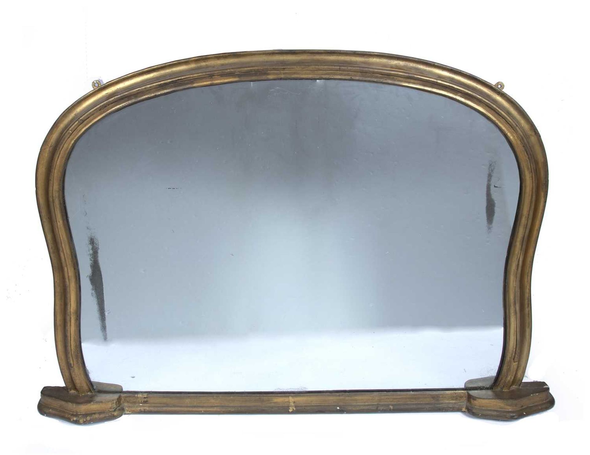 Gilt overmantel mirror 19th Century, of shaped fluted form, 146cm wide, 100cm high Some marks to