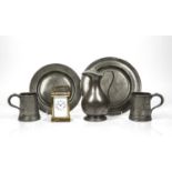 Collection of pewter comprising of: water jug with lid, two tankards, two plates, some with marks