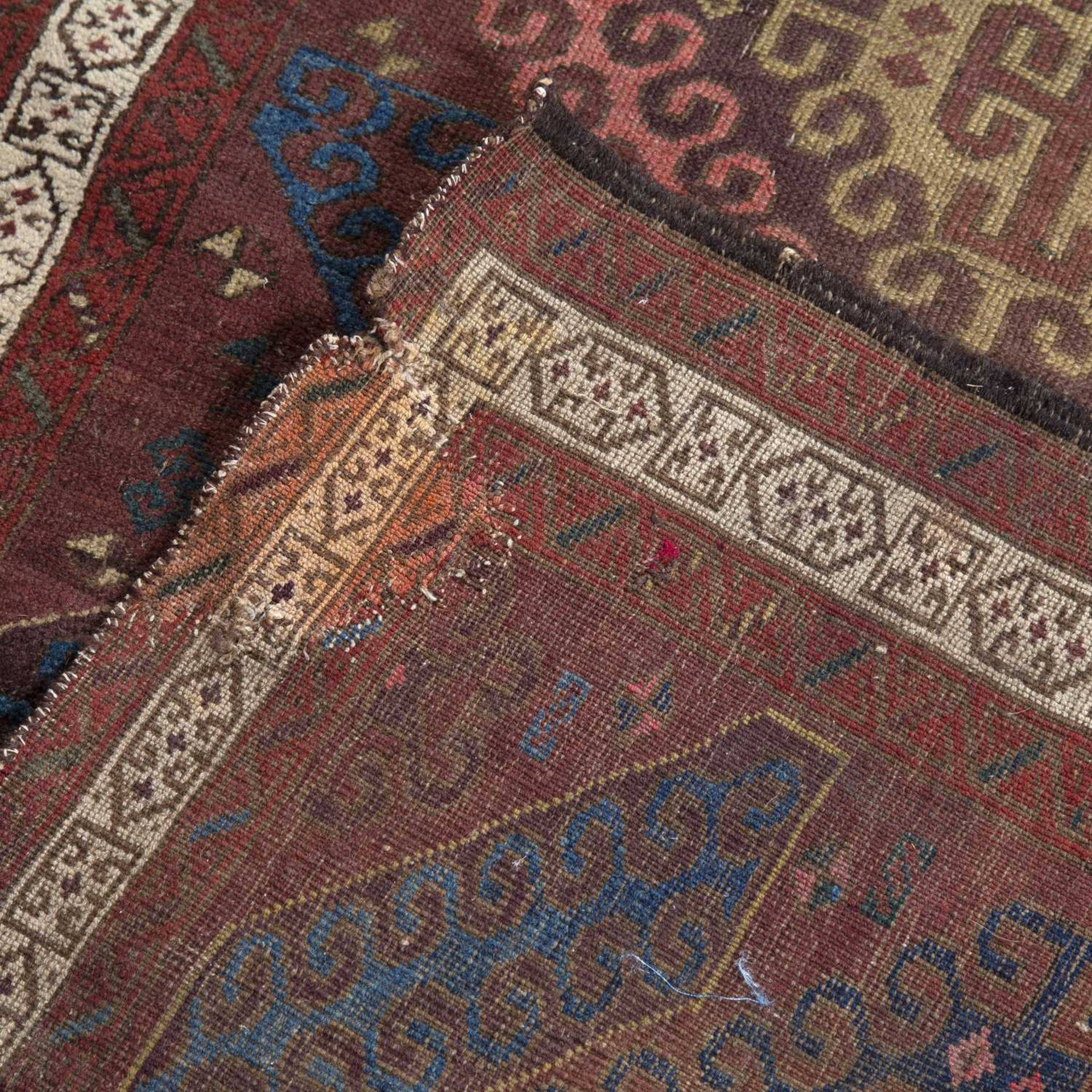 Beluch rust ground runner with five medallions, 240cm x 78cmOld repairs, worn and frayed - Image 2 of 2
