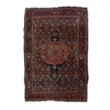 Bijar blue ground rug with central foliate medallion and trailing designs, 204cm x 134cmOverall wear