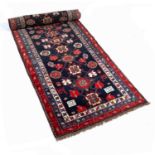 Blue ground Karabagh runner South Caucasian, with flowerhead, foliate and animal designs within a