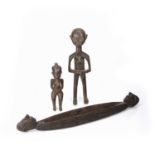 Tribal Interest three wooden carvings, two of nude figures, largest 42cm, smallest 26cm and a vessel