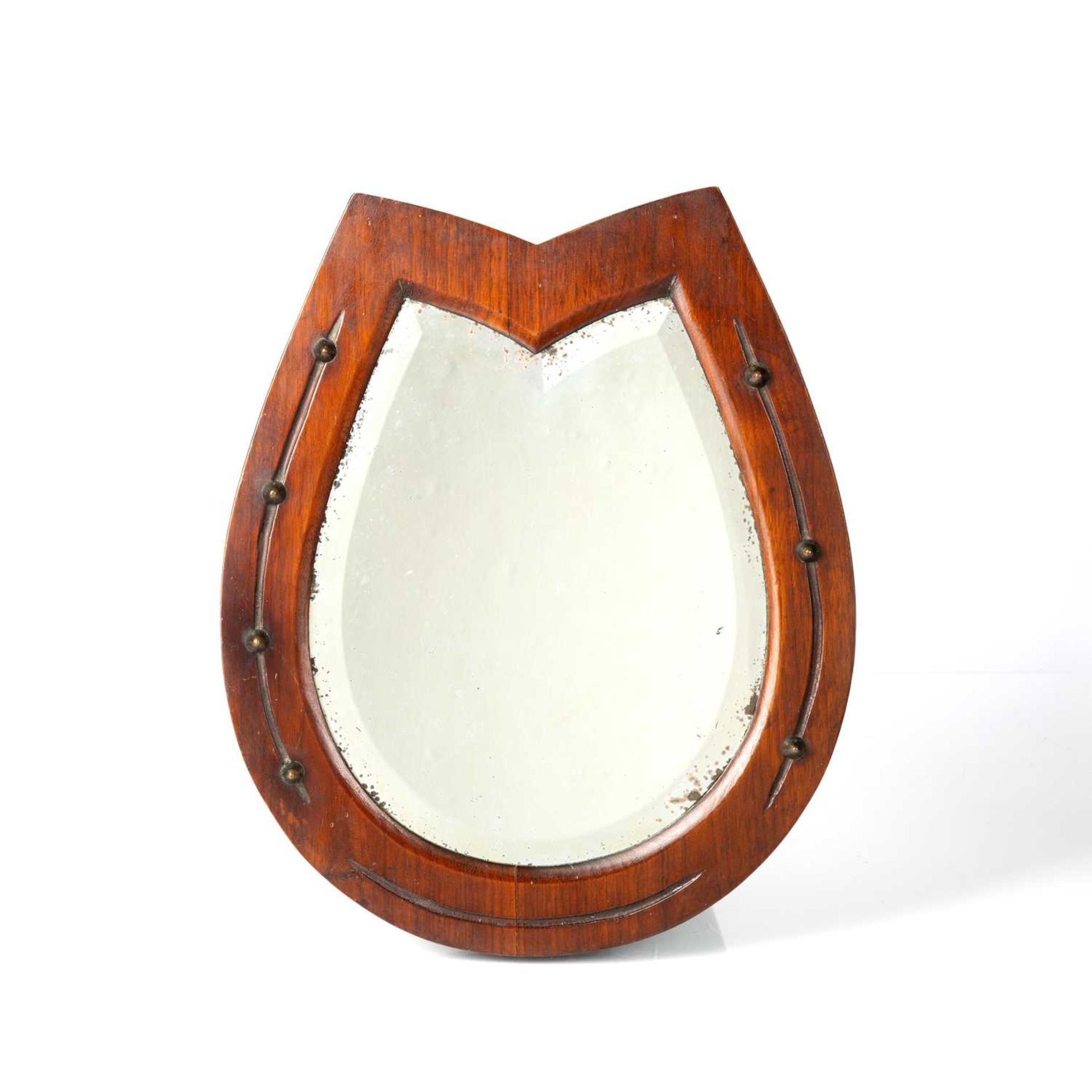 Oak framed horse shoe mirror Late 19th/early 20th Century, with bevelled edge mirror plate, 37cm