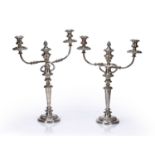 Matched pair of silver-plated twin branch candelabra on circular socle bases, unmarked, tallest is