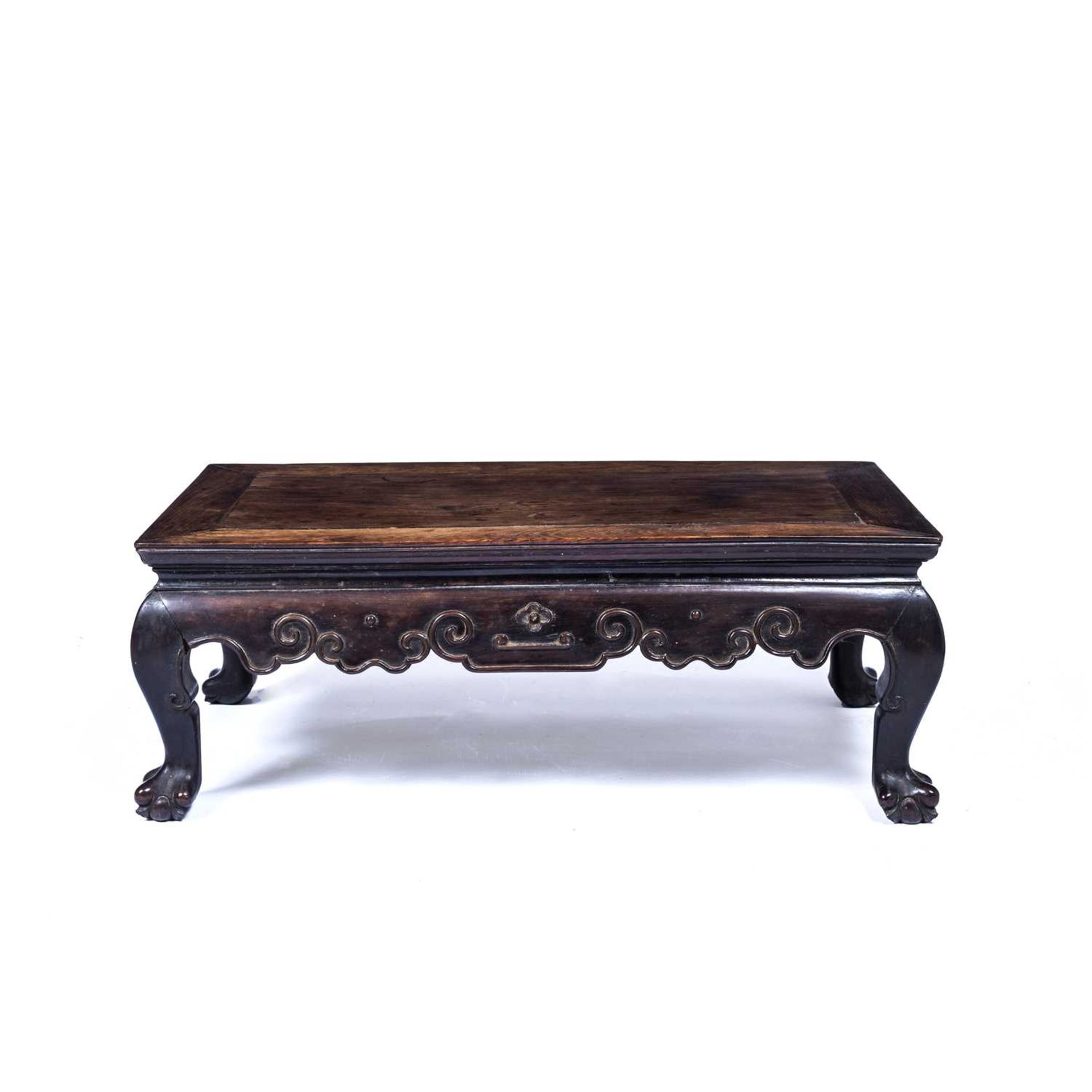 Hardwood carved 'Kang' table Chinese, with a carved under tier with cloud-shaped motifs, 76cm across