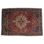 Isfahan rug of red ground with central medallion, 151cm 81cmOne border cut and with overall wear.